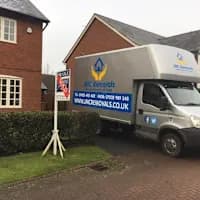 JMC Removals van at detached home — removal company Warrington